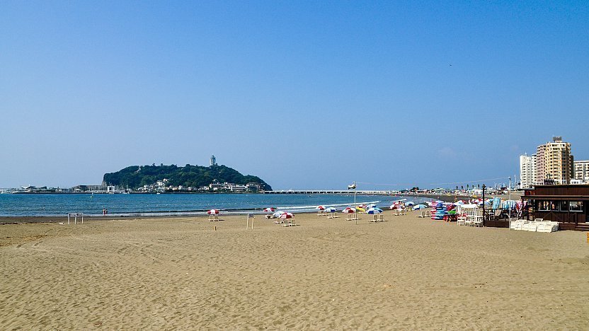 Scenic panoramic view of the Pacific Ocean and Shonan coastline looking back from the high terraced forest paths near the summit of Enoshima Island