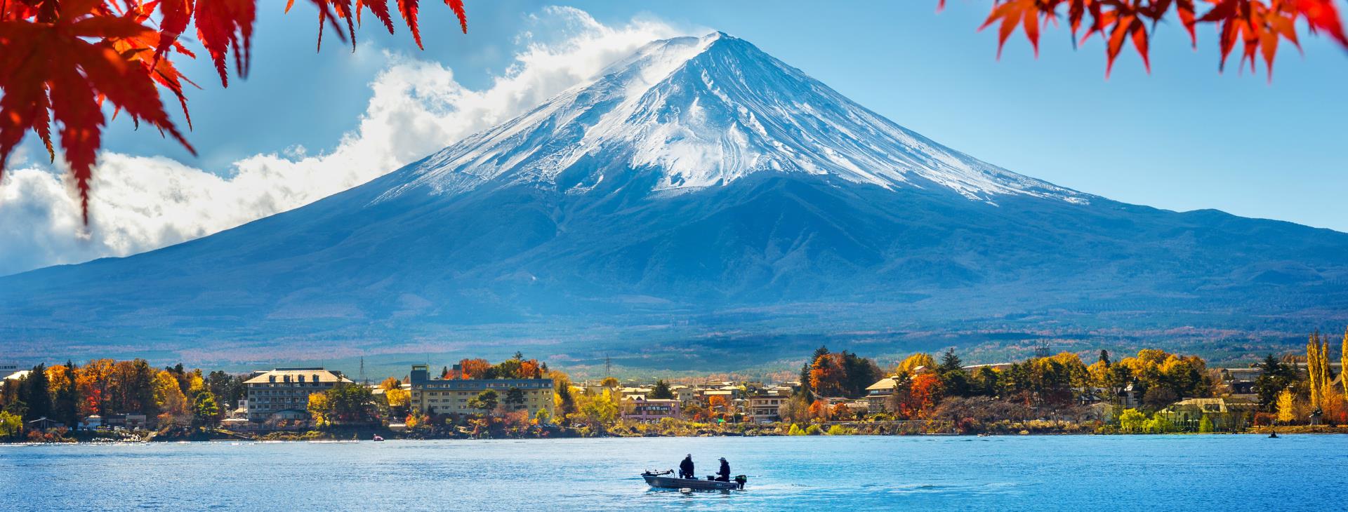 Mount Fuji rising above Lake Ashi with a red torii gate, viewed on a private Hakone day trip