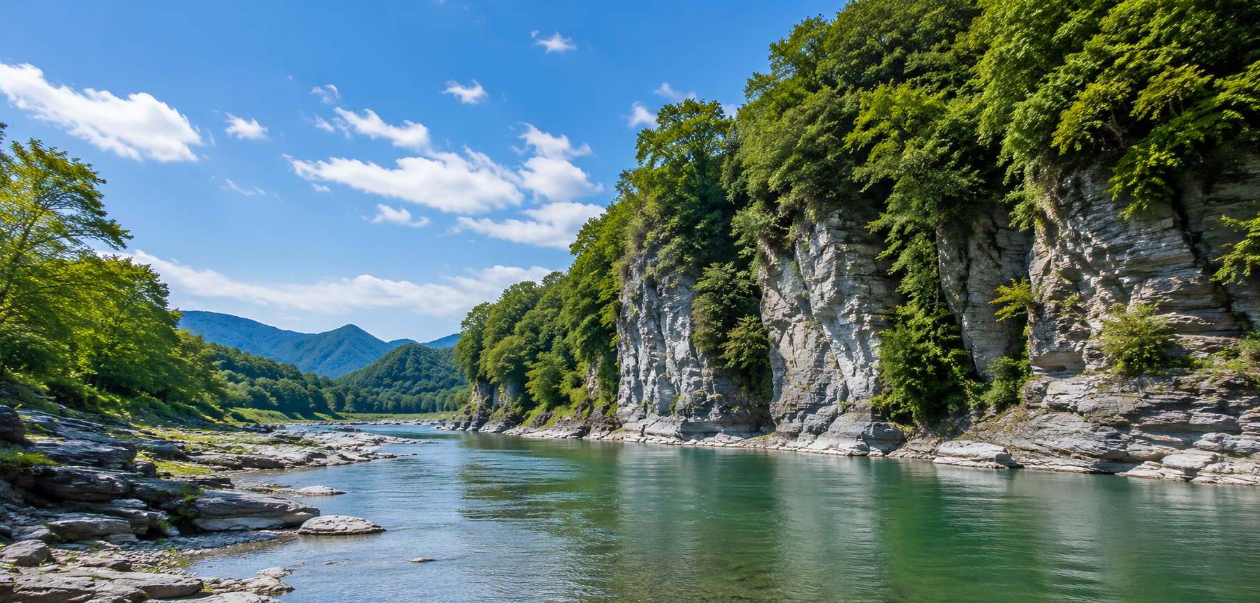 Traditional wooden boat cruising past river cliffs on the Arakawa River in Nagatoro, Chichibu, Saitama