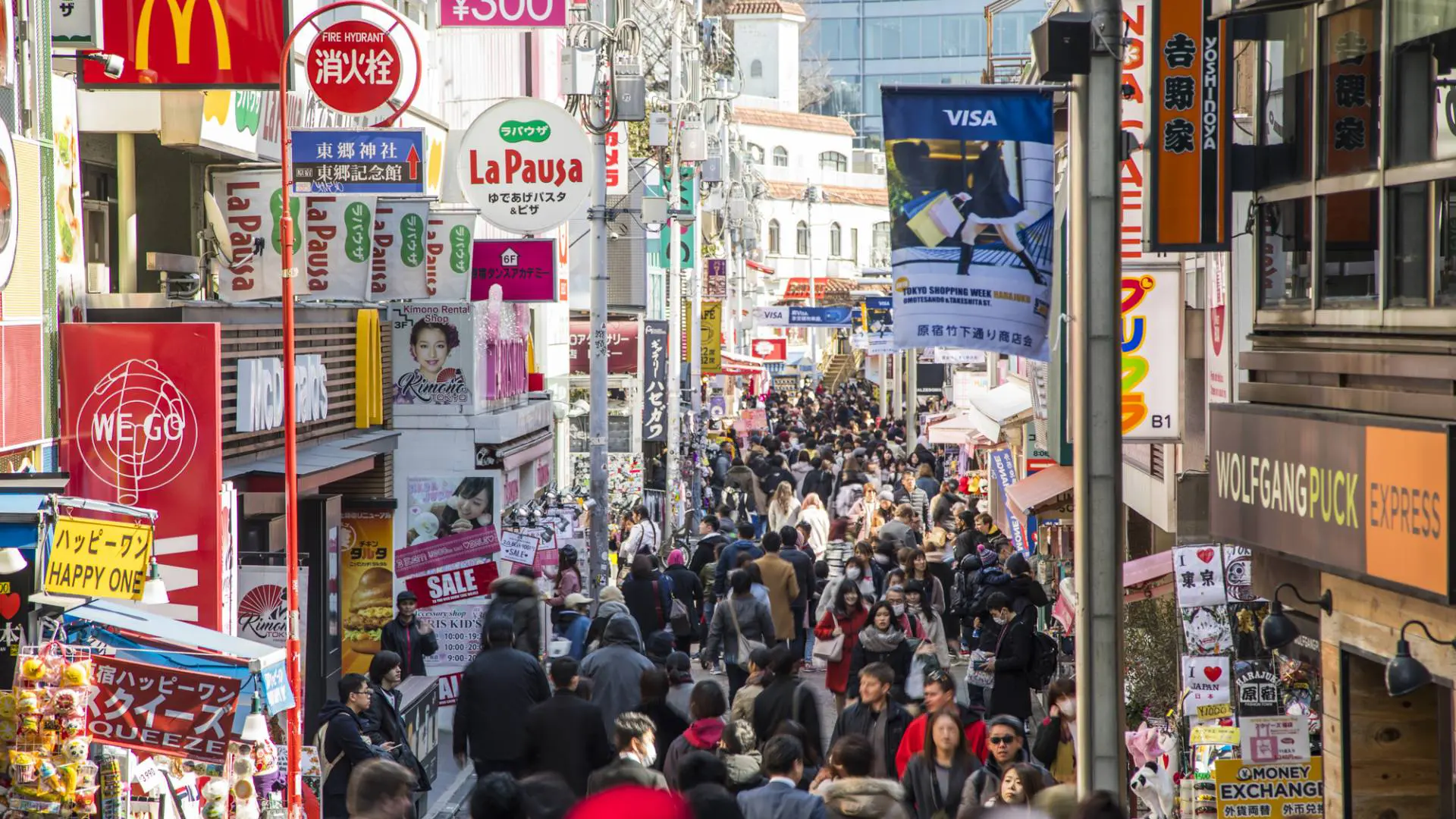 Colorful independent clothing shops and crepe stands on Takeshita Street pedestrian lane in Harajuku