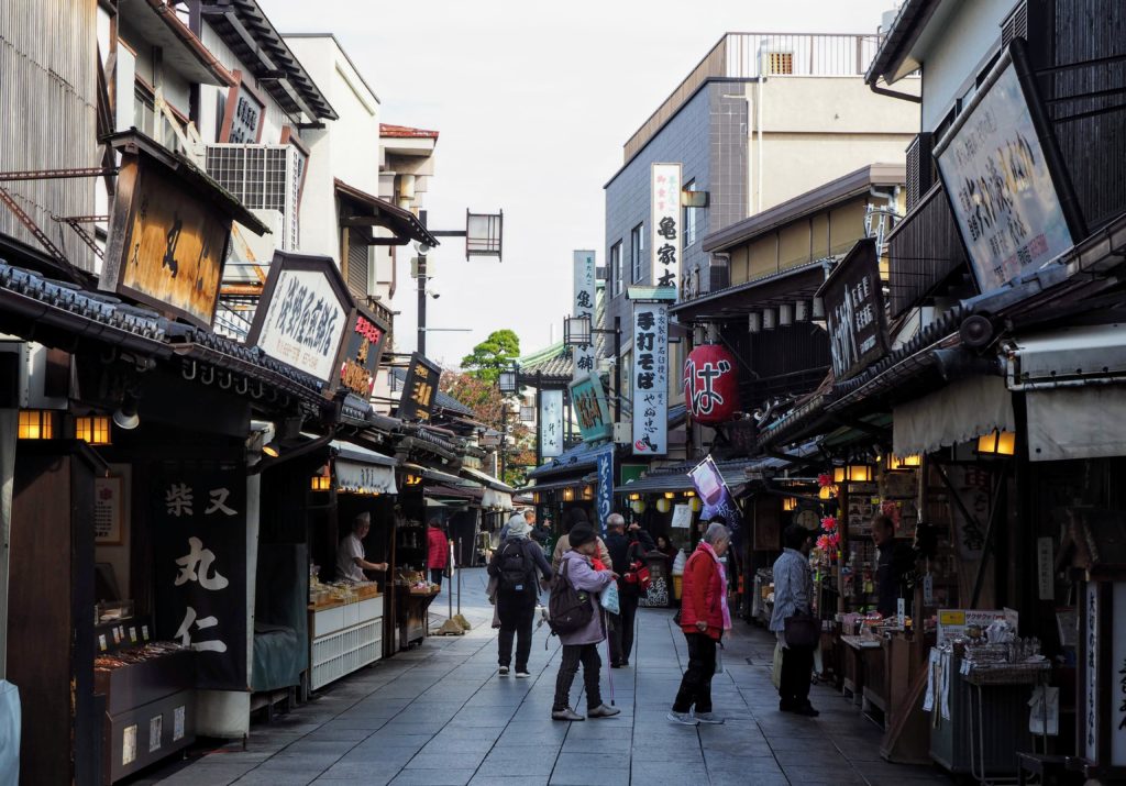 Terry guiding travelers through narrow, quiet residential backstreets and historical neighborhoods in Tokyo