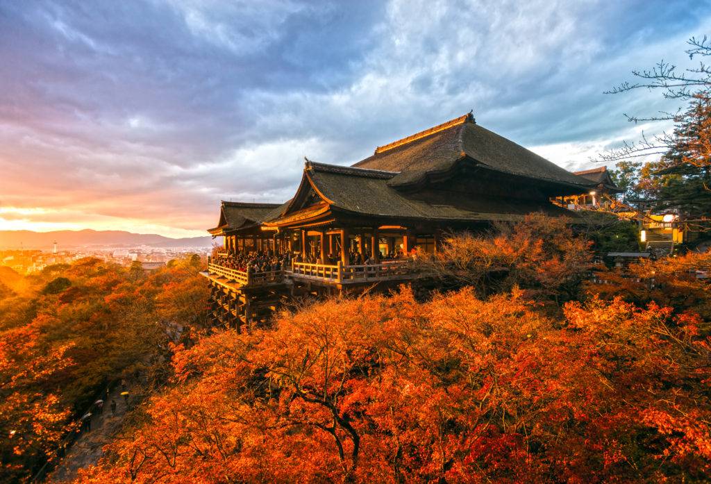 The wooden stage of Kiyomizu-dera temple overlooking the forested Higashiyama hills in Kyoto
