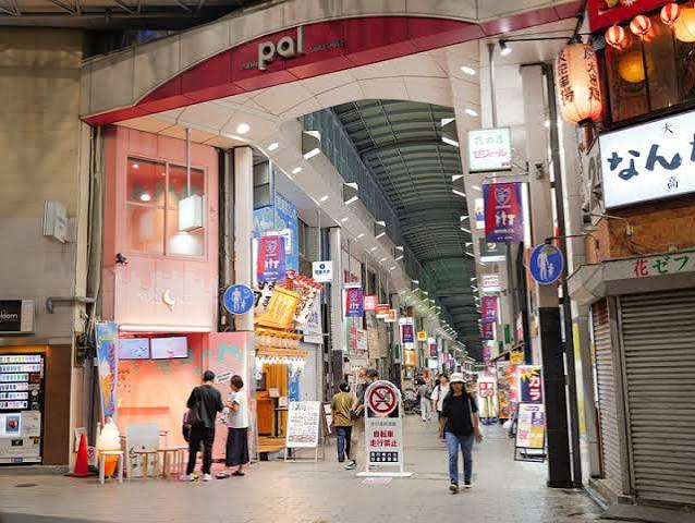 A covered shopping arcade running beneath the train tracks in Koenji