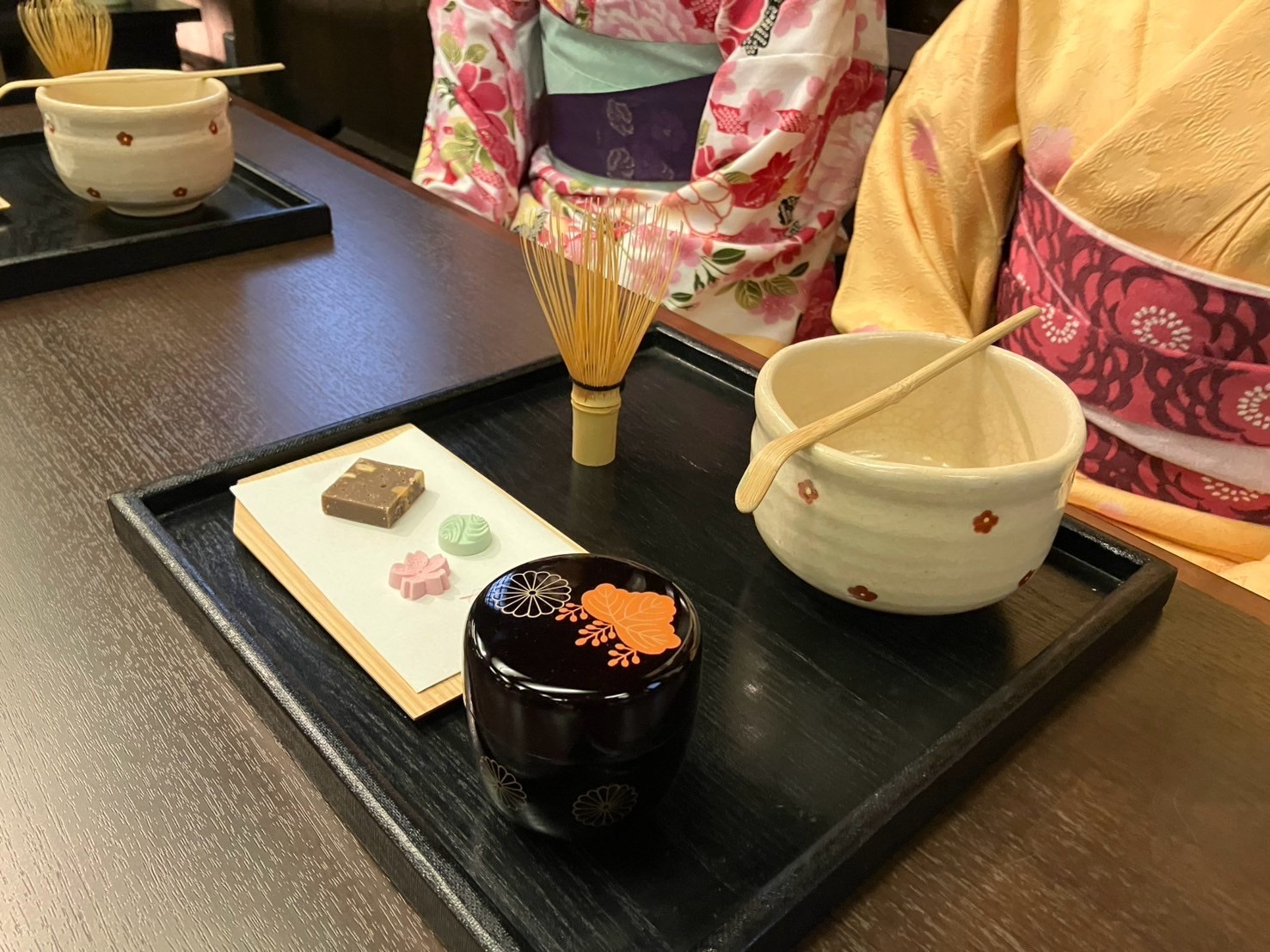 Matcha tea and wagashi sweets served inside a converted kura warehouse café in Tochigi