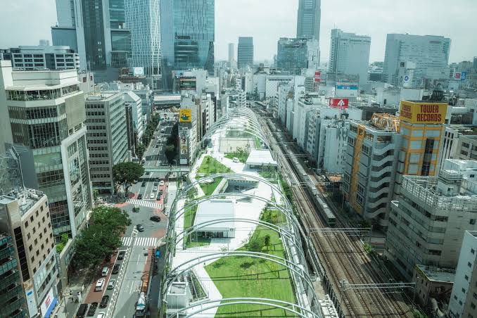 Shoppers browsing the rooftop park and retail complex at Miyashita Park in Shibuya