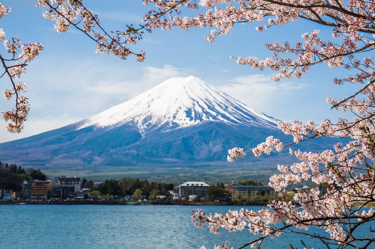 Snow-capped peak of Mount Fuji rising behind Lake Ashi in Hakone on a custom private day trip