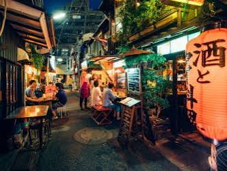 Quaint brick-paved lanes lined with small independent antique shops, vintage furniture stores, and cozy neighborhood cafes in Nishi-Ogikubo