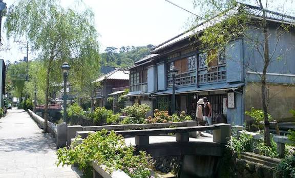A willow-lined canal walk along Perry Road in Shimoda
