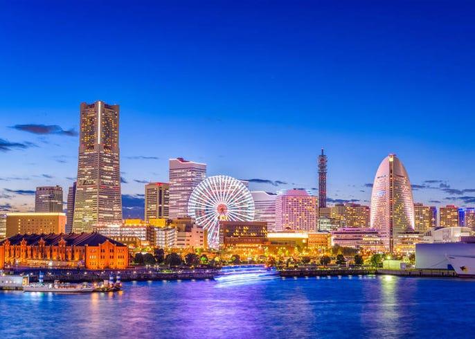 Modern waterfront skyline and giant Ferris wheel at Minato Mirai port city in Yokohama